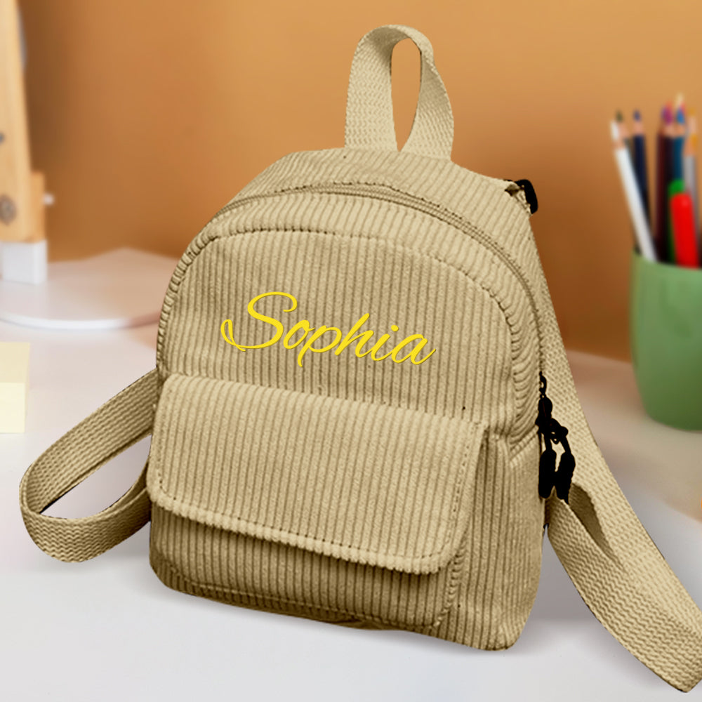 Personalized mini corduroy backpack by MadeMine with custom name, ideal for kids' school and back-to-school gift.