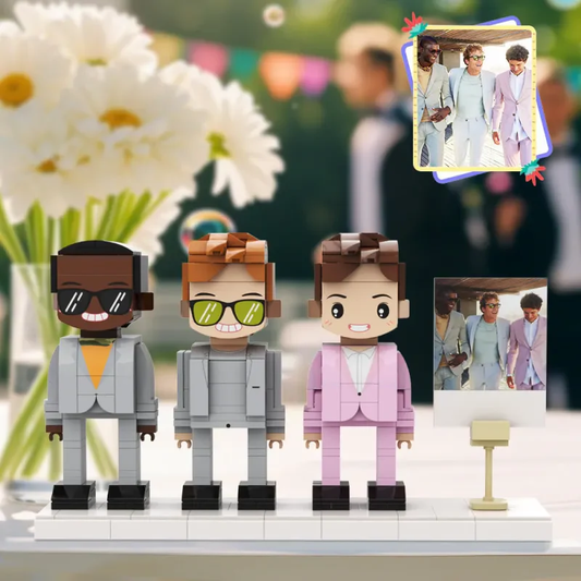Three custom brick figures in suits based on a real group photo, displayed on a shared base plate