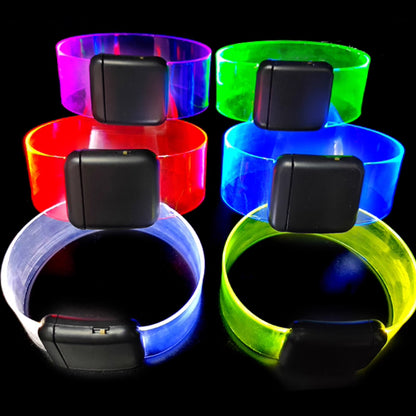Custom LED glow bracelet by MadeMine with personalized photo and text, illuminated with vibrant colors for special occasions.
