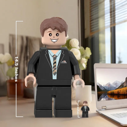Custom giant Minifigs by MadeMine, personalized with your photo, featuring colorful, detailed 3D printed minifigure characters.