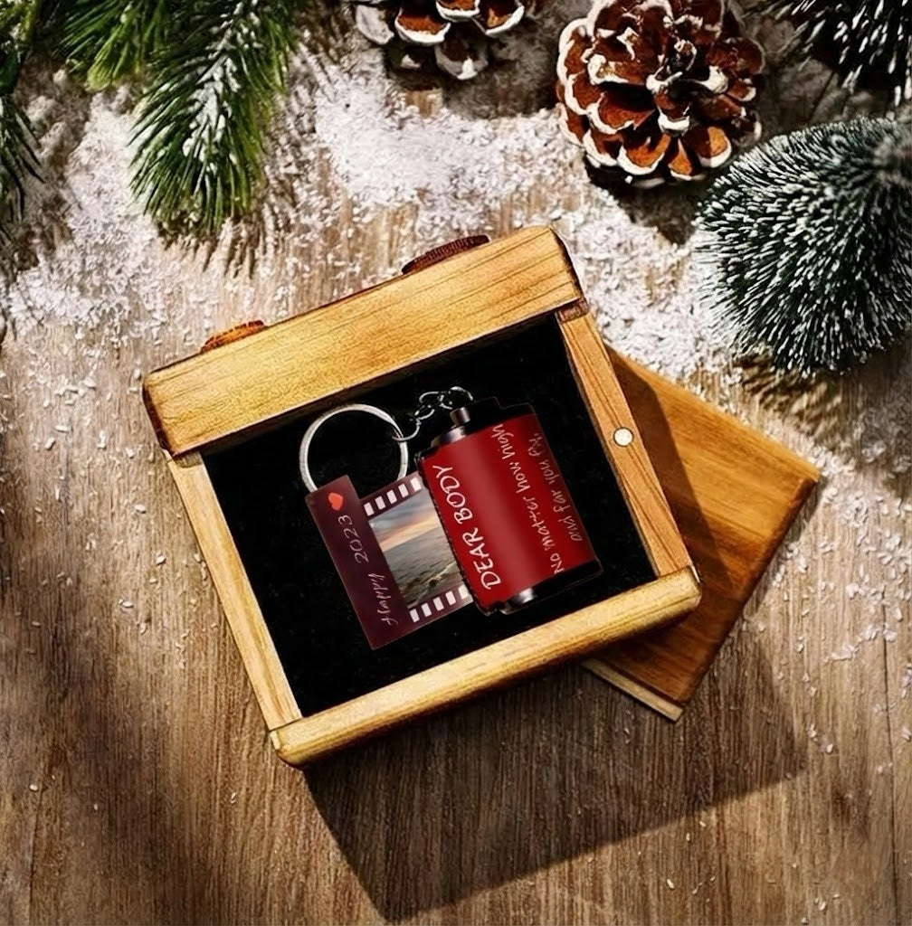 MadeMine personalized photo film roll keychain with gift box, featuring a custom photo and silver metal design.