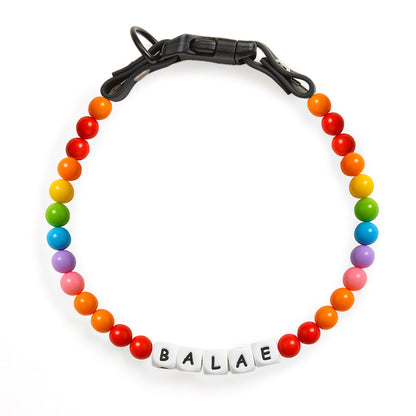 Colorful beaded dog collar with engraved name tag, made by MadeMine, featuring multicolor beads and adjustable one-size fit.