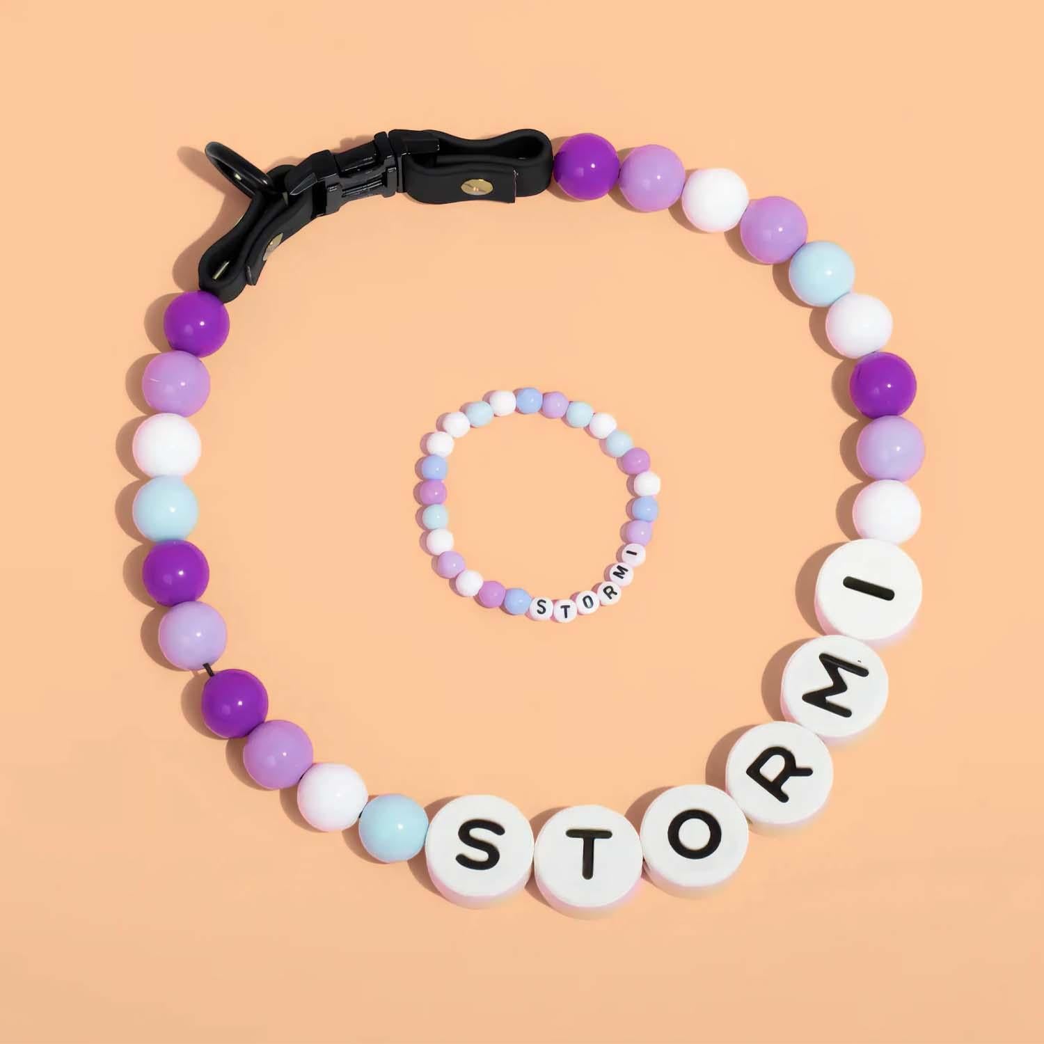 Personalized pet name necklace with matching bracelet by MadeMine, featuring engraved pet names on jewelry pieces.