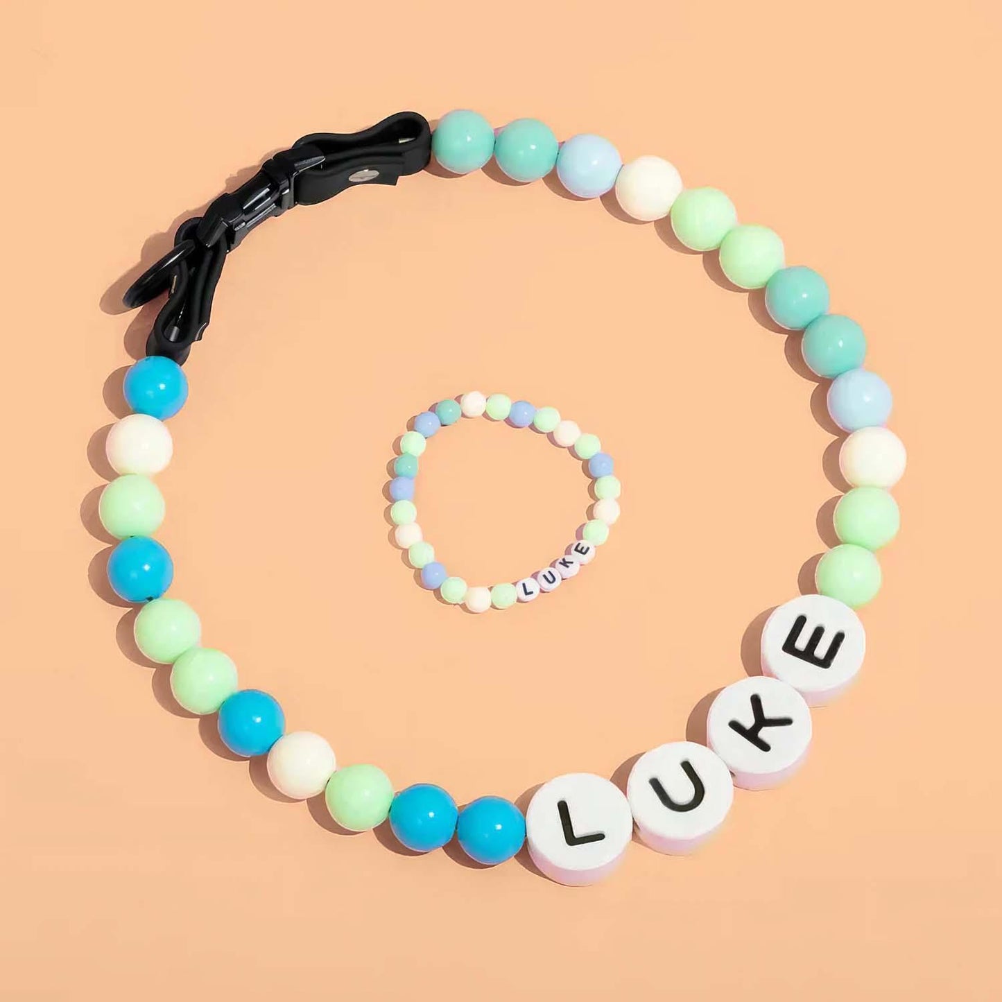 Personalized pet name necklace and matching bracelet from MadeMine, featuring custom engraved pet names on jewelry pieces.