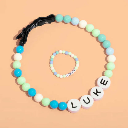 Personalized pet name necklace and matching bracelet from MadeMine, featuring custom engraved pet names on jewelry pieces.