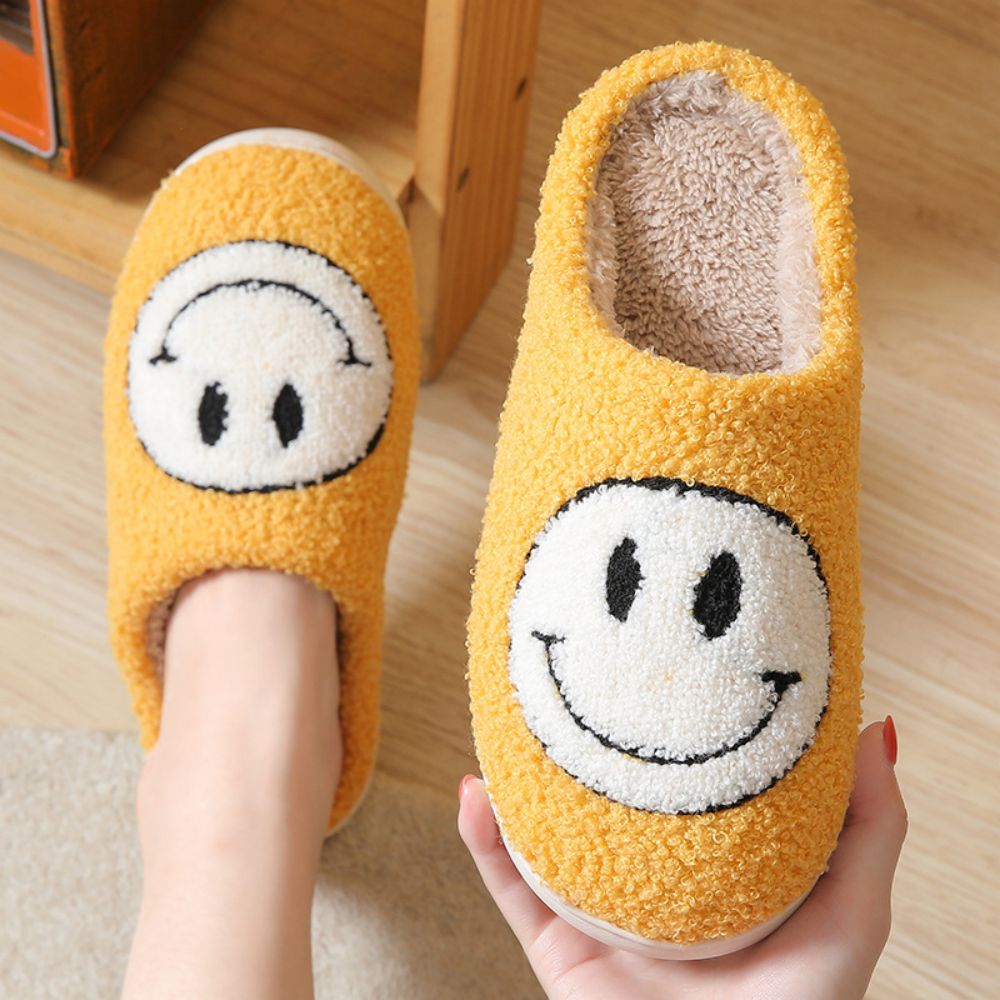 Fuzzy smiley face cotton slippers from MadeMine featuring warm, fluffy, cozy design for women and men.