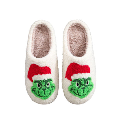 MadeMine Christmas Grinch slippers with cotton material, featuring festive green and red design, perfect for holiday home comfort.