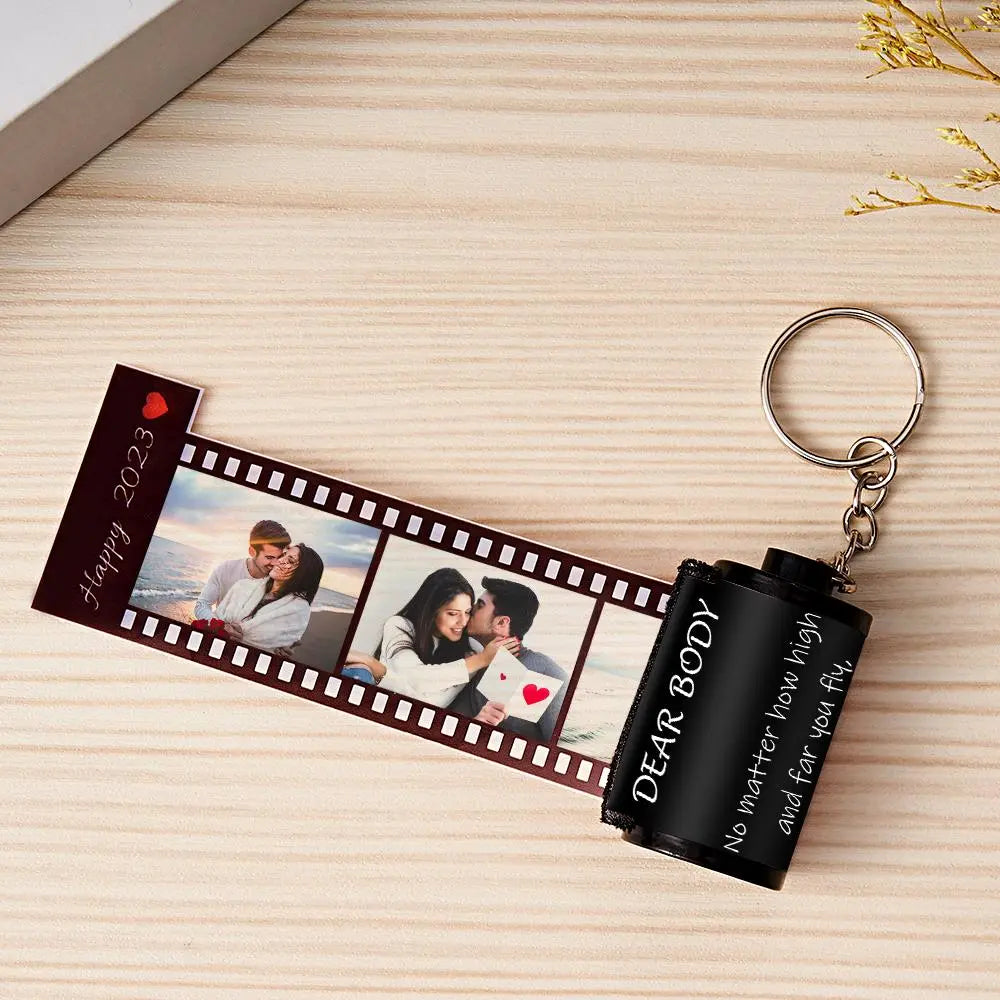 MadeMine personalized photo film roll keychain with gift box, featuring a customizable photo on a sleek metal keychain.