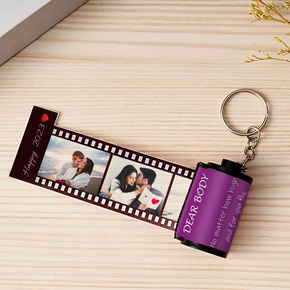 Personalized MadeMine photo film roll keychain with custom photo, attached to a gift box for a unique keepsake.